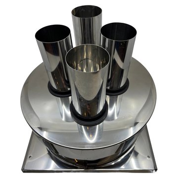 Inox multikap met vier rookgasbuizen op een dakplaat